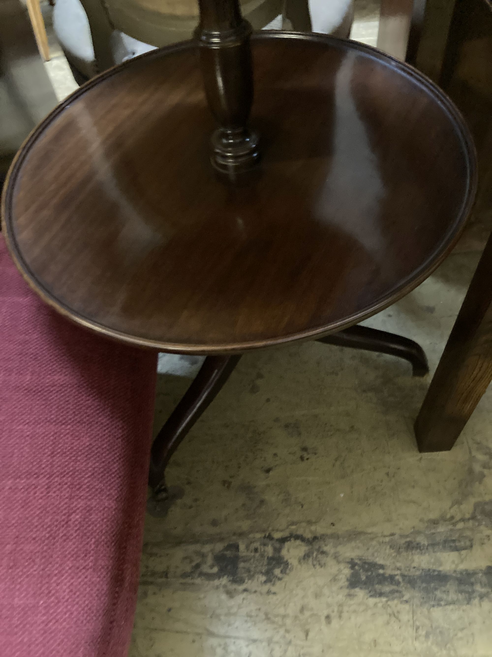 A George III and later mahogany three tier dumb waiter, 54cm diameter, height 108cm